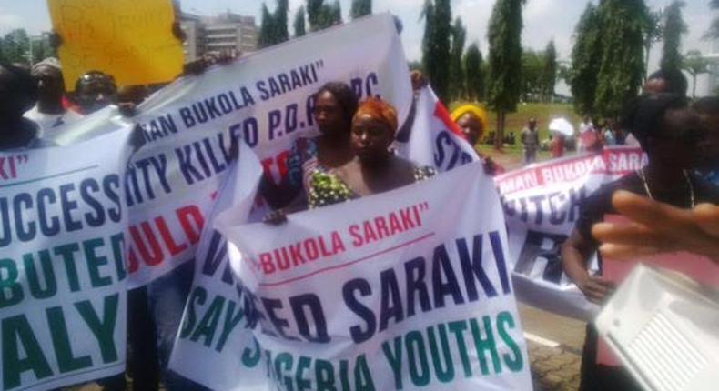 Supporters of Senate President, Bukola Saraki protest outside the National Assembly in Abuja on September 29, 2015