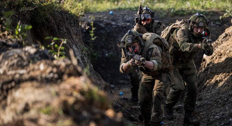 Instructors from the Norwegian Home Guard participate in a blank fire exercise, together with Ukrainian soldiers, as part of training with NATO-standard combat methods to enhance Ukrainian military capabilities, on August 25, 2023, north of Trondheim, Norway.Jonathan Nackstrand /AFP via Getty Images