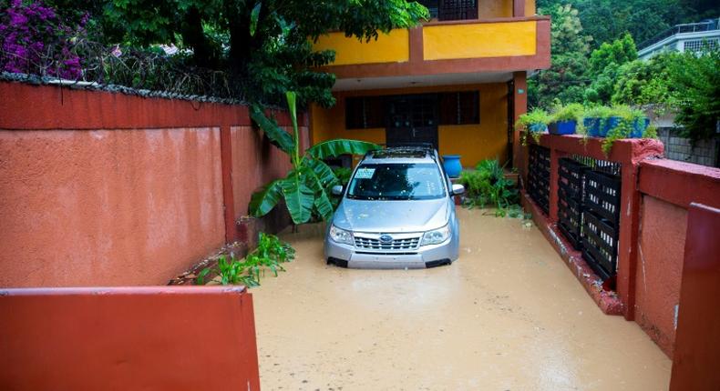 Floodwaters encircle a home in Pietonville, Haiti, after Storm Laura