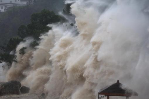 Waves brought by Typhoon Maria lash the shore in Wenzhou