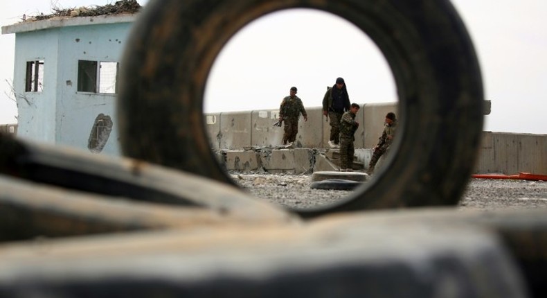 Members of the US-backed Syrian Democratic Forces inspect a dam recently recaptured from jihadists near Raqa on March 27, 2017