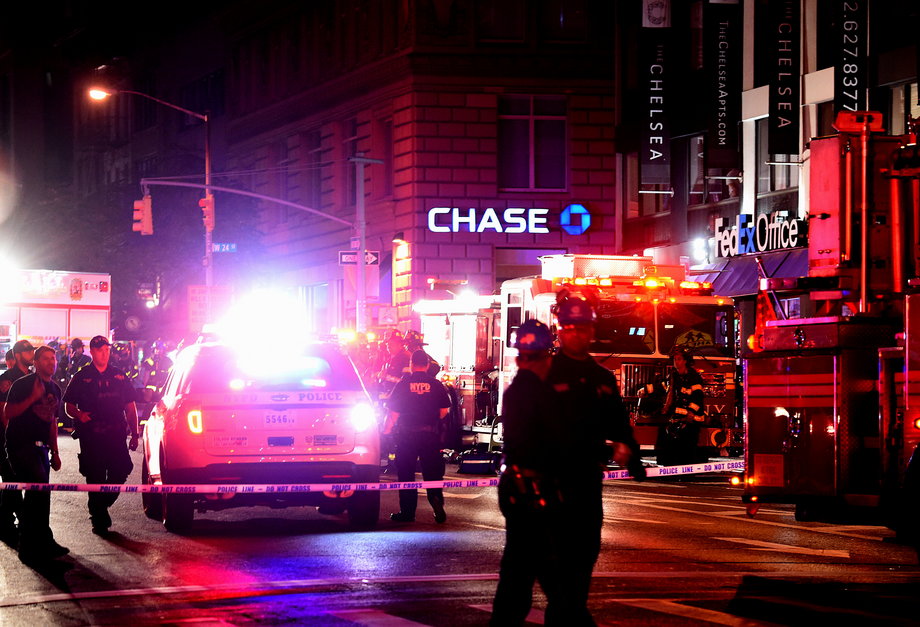 Police officers and firefighters respond to an explosion on September 17, 2016 at 23rd Street and 7th Avenue in the Chelsea neighborhood of New York City.