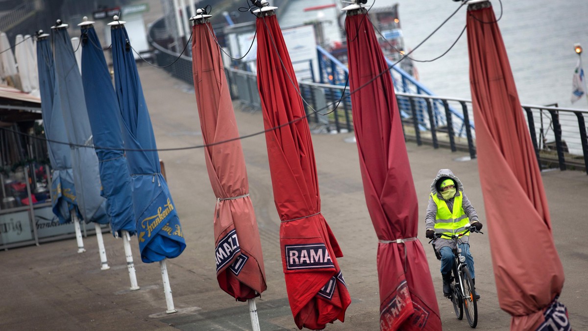 Wrapped-up parasols at the Rhine embankment promenade