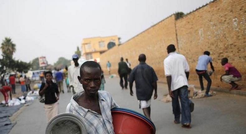 A man sells pots at a marketplace in Burundi's capital Bujumbura, as the country awaits the results of Tuesday's presidential elections, July 23, 2015. REUTERS/Mike Hutchings