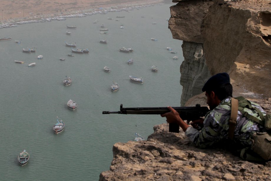 Iranian military personnel watch over the Strait of Hormuz, which they have threatened, though not credibly, to close off to US forces.