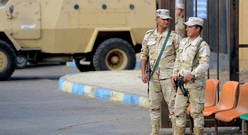 Egyptian conscripts stand guard after a bomb and gun assault on a North Sinai mosque in November 2017 killed more than 300 people and triggered a major offensive against the jihadists