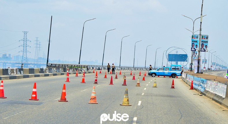 Lagos State Traffic Management Authority (LASTMA) officers place cones on the Third Mainland Bridge (Pulse)