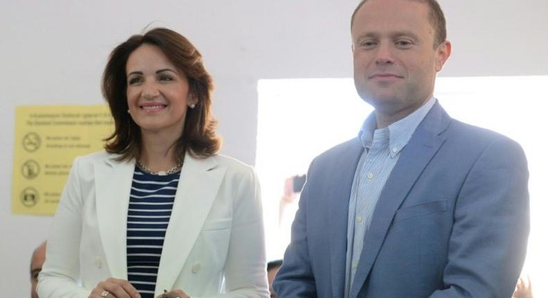 Malta's Prime Minister Joseph Muscat and his wife Michelle Muscat prepare to vote at a polling station in his home town of Burmarrad on June 3, 2017