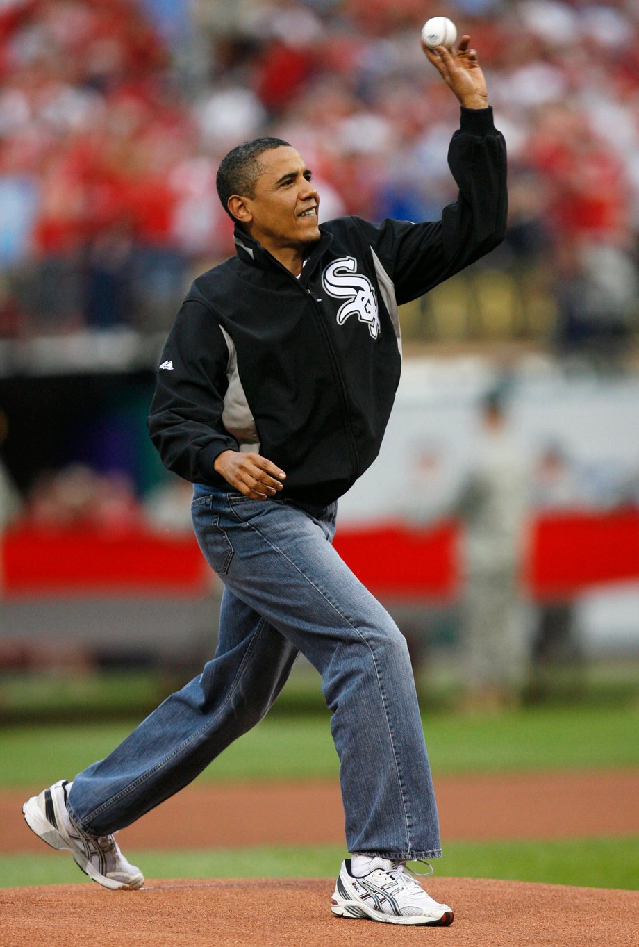 Obama throws the ceremonial first pitch prior to the start of Major League Baseball's All-Star game in St. Louis, July 14, 2009.