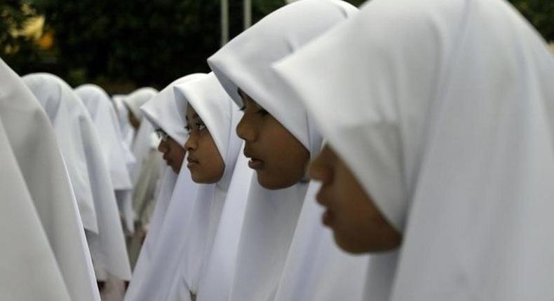 Students assemble before class at the Madrasah Al Maarif Al Islamiah in Singapore February 21, 2006.