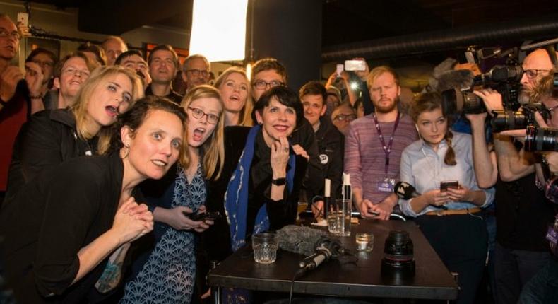 Politician and co founder of Iceland's Pirate Party Birgitta Jonsdottir (C), Asta Gudrun Helgadottir (2nd,L) are seen alongisde party members after parliamentary elections in Iceland, on October 25, 2016