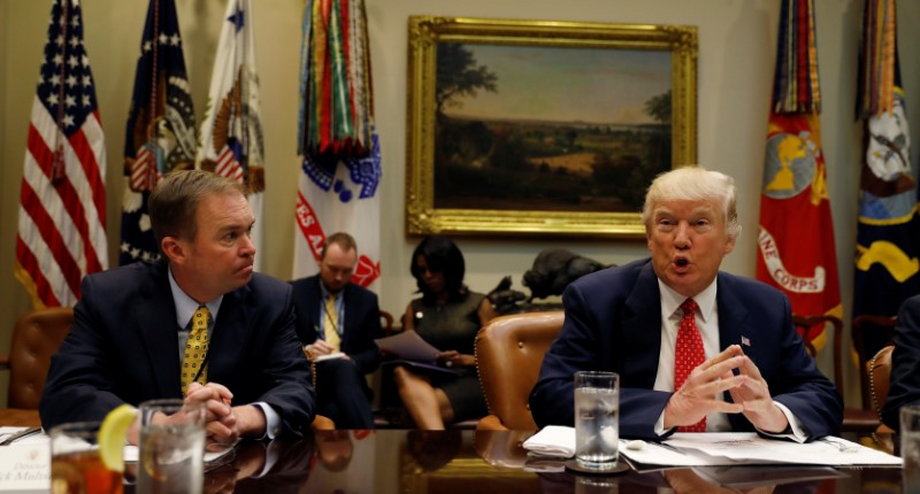 Director of the Office of Management and Budget Mick Mulvaney, left, with President Donald Trump at a "strategic initiatives" lunch at the White House, February 22, 2017.