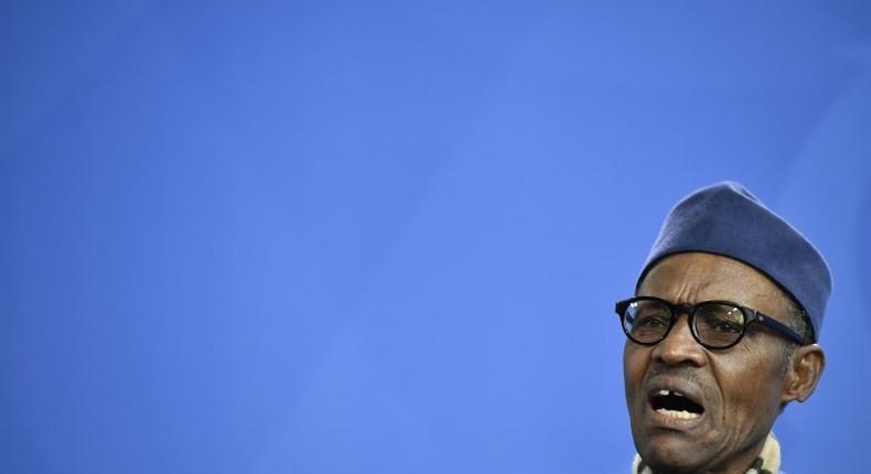 Nigeria's President Muhammadu Buhari gives a press conference in Berlin on October 14, 2016