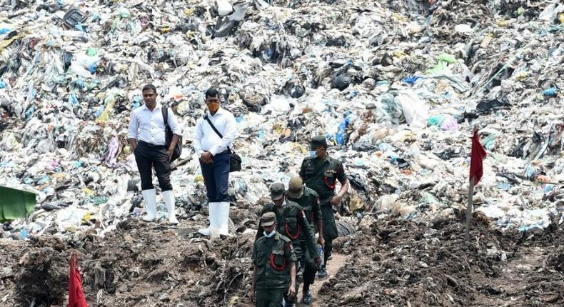 Sri Lankan military at the site of a collapsed garbage dump in Colombo on April 18, 2017