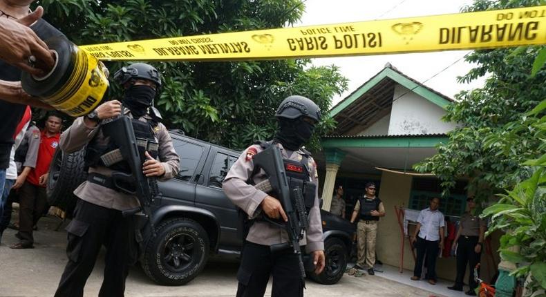 Anti-terror police secure the residence of a suspect who attacked several policemen in Tangerang, Banten province, on October 20, 2016