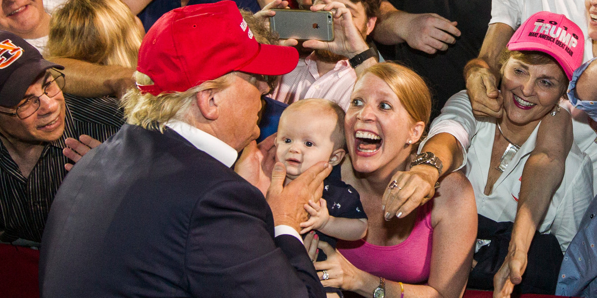 Republican presidential candidate Donald Trump greets supporters after his rally at Ladd-Peebles Stadium on August 21, 2015 in Mobile, Alabama.