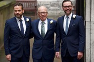 Media Mogul Rupert Murdoch poses for a photograph with his sons Lachlan and James as they arrive at 