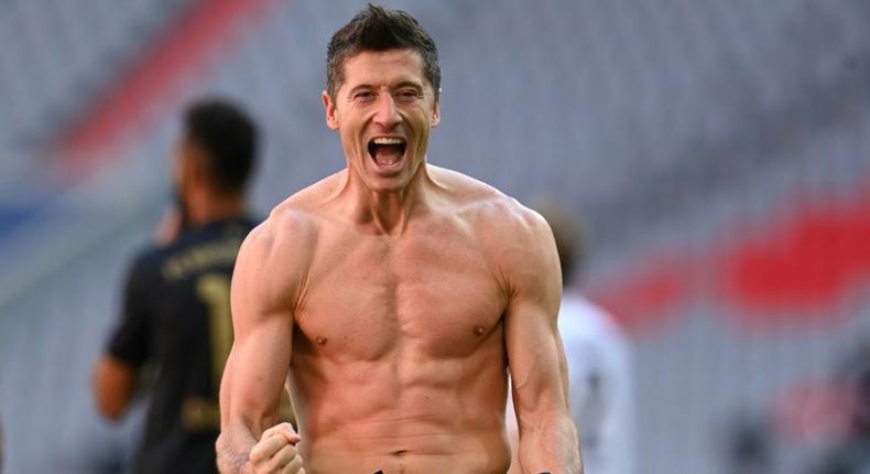 Bayern Munich striker Robert Lewandowski celebrates scoring a record 41st Bundesliga goal this season Creator: CHRISTOF STACHE