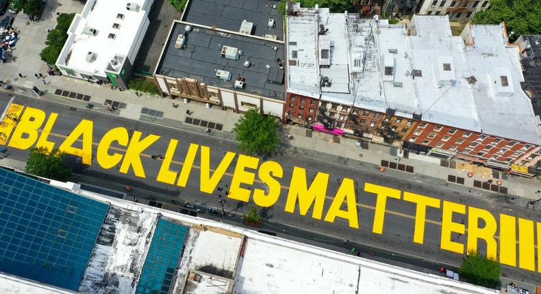 black lives matter mural nyc NEW YORK, USA - JUNE 15: An aerial view of 'Black Lives Matter' mural painting is seen on Fulton Street in Brooklyn, New York City, United States on June 15, 2020. (Photo by Tayfun Coskun/Anadolu Agency via Getty Images)