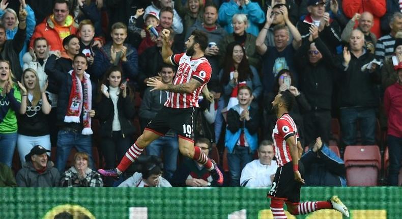 Charlie Austin (left) celebrates after scoring Southampton's opening goal against Burnley at St Mary's Stadium in Southampton on October 16, 2016