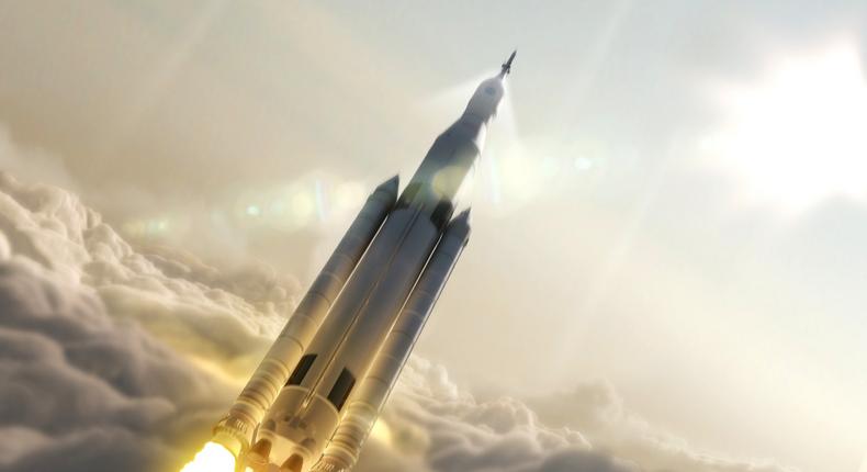 An artist's depiction of NASA's Space Launch System rocketing a crew toward orbit.