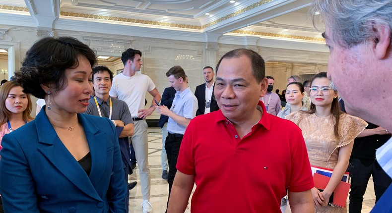 VinFast CEO Le Thi Thu Thuy (left) speaks to VinGroup founder and Chairman Pham Nhat Vuong.Kevin Krolicki/Reuters