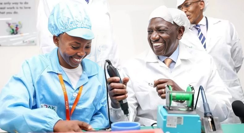 President William Ruto is shown how the smart phones are made at the East Africa Device Assembly Kenya factory in Athi River, Machakos during its launch on October 30, 2023.