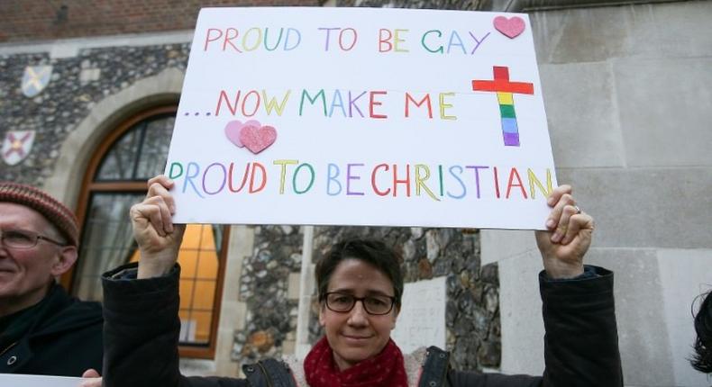 Gay rights campaigners protest outside Church House in London on February 15, 2017