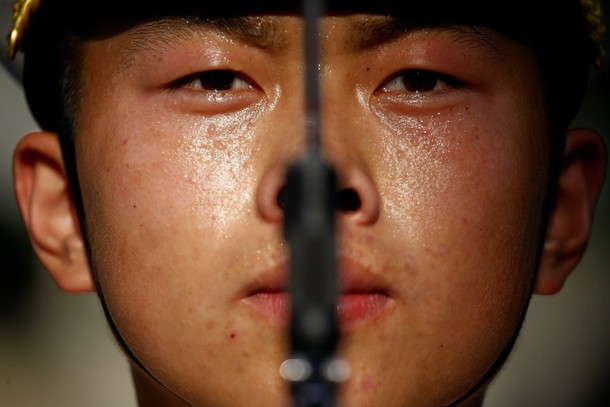 A member of the honour guard prepares for a welcoming ceremony for Argentina's President Mauricio Ma