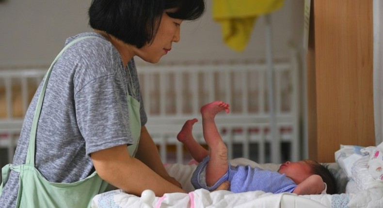 A social worker caring for a baby at the Jusarang Community Church in South Korea, where the number of abandoned babies has jumped in recent years in the wake of a law intended to protect children.