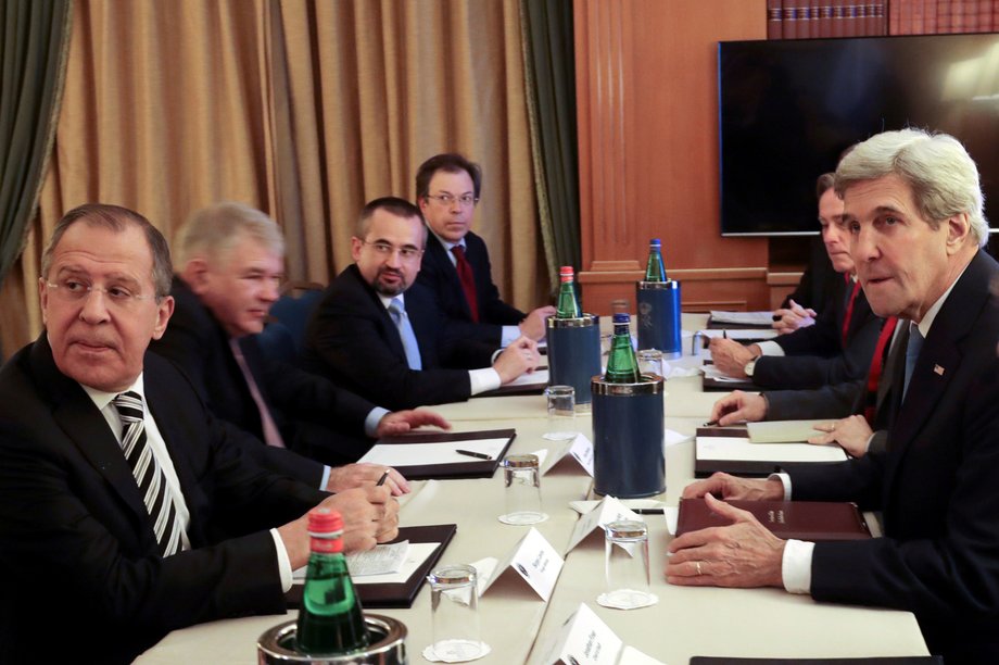 Russian Foreign Minister Sergey Lavrov, left, and US Secretary of State John Kerry, right, attend a meeting in Rome on December 2.