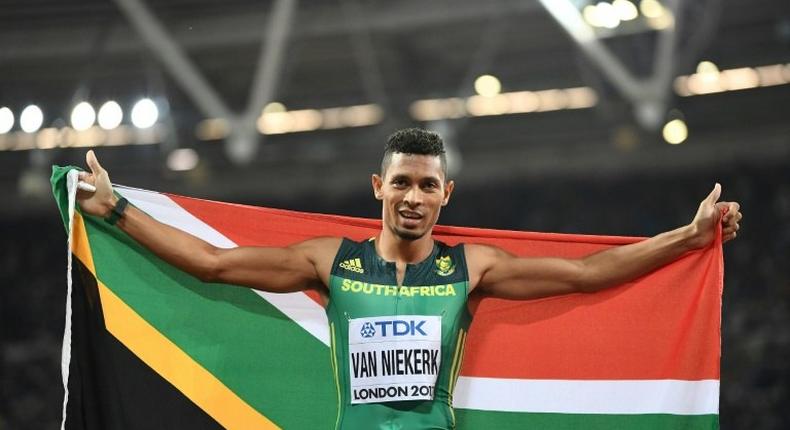 South Africa's Wayde Van Niekerk celebrates after winning the final of the men's 400m at the 2017 IAAF World Championships in London on August 8, 2017