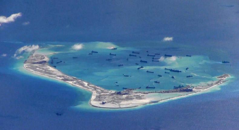 Still image from United States Navy video purportedly shows Chinese dredging vessels in the waters around Mischief Reef in the disputed Spratly Islands