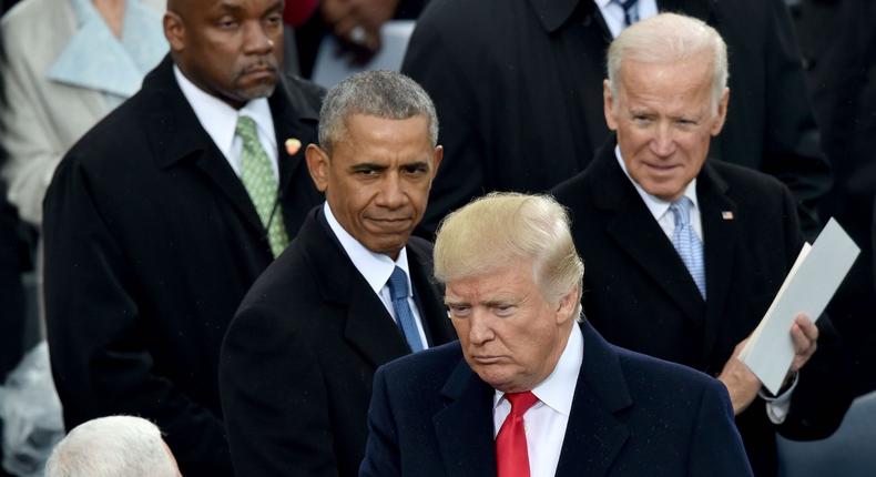 Trump is in this picture with Joe Biden (Right) and Barack Obama (Left)--AP