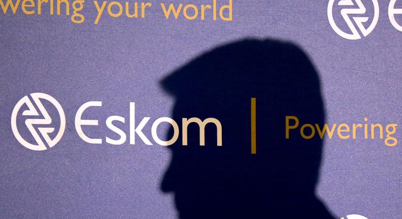 The shadow of a new Chief Executive of state-owned power utility Eskom Andre de Ruyter, is seen as he speaks at a media briefing in Johannesburg.Reuters