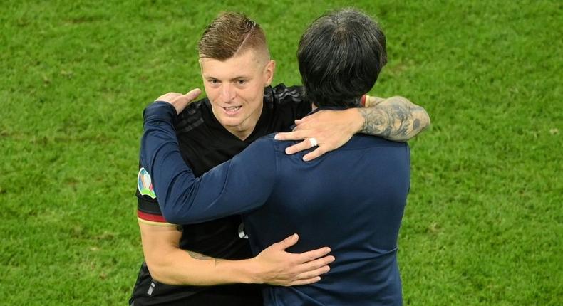 Toni Kroos hugs head coach Joachim Loew after Germany's 2-2 draw with Hungary put them in the last 16 of Euro 2020 Creator: Matthias Hangst