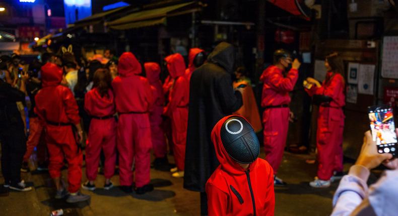 People wear 'Squid Game' costumes  in Hong Kong.
