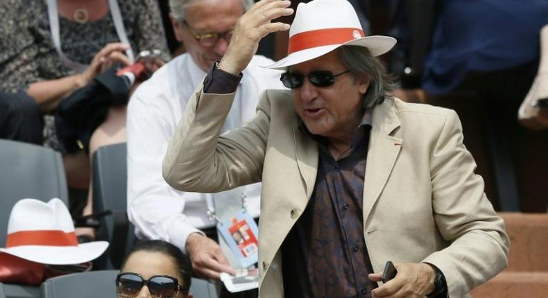 Romanian Fed Cup captain Ilie Nastase (C) has been suspended by the International Tennis Federation (ITF) over foul-mouthed and abusive behaviour during the tie against Britain