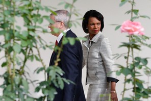 U.S. Secretary of State Rice walks with White House Chief of Staff Bolton at the White House in Wash