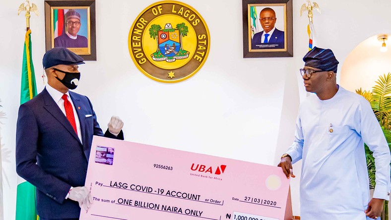 Donation to Lagos 1: UBA Supports Lagos State in Fight Against COVID-19 . Group Managing Director/CEO, United Bank for Africa(UBA), Mr, Kennedy Uzoka presenting a cheque of N1 billion to Governor of Lagos State, Mr. Babajide Sanwo-Olu, as part of the Bank’s donation of over 5 billion Naira (USD14 million), through the UBA Foundation, to catalyse a comprehensive pan-African response to the fight against the coronavirus (COVID-19) global pandemic., in Lagos House, Marina on Sunday. 