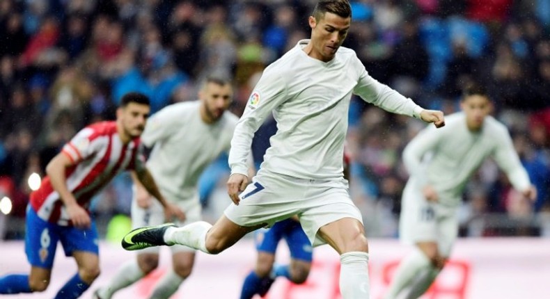 Real Madrid's Portuguese forward Cristiano Ronaldo plays against Real Sporting de Gijon at the Santiago Bernabeu stadium in Madrid on November 26, 2016