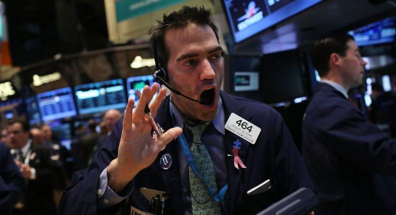 Traders work on the floor of The New York Stock Exchange.
