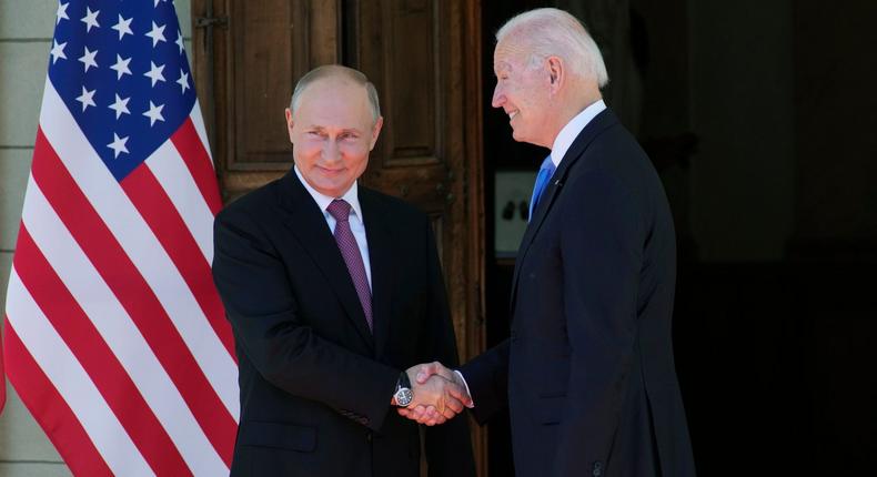 Russian President Vladimir Putin and US President Joe Biden shake hands at the Villa la Grange in Geneva, Switzerland, ahead of a US-Russia summit on June 16, 2021.
