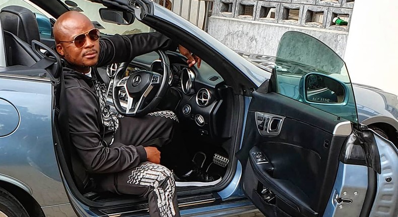 Jalang'o poses inside his Mercedes Benz SLK 200