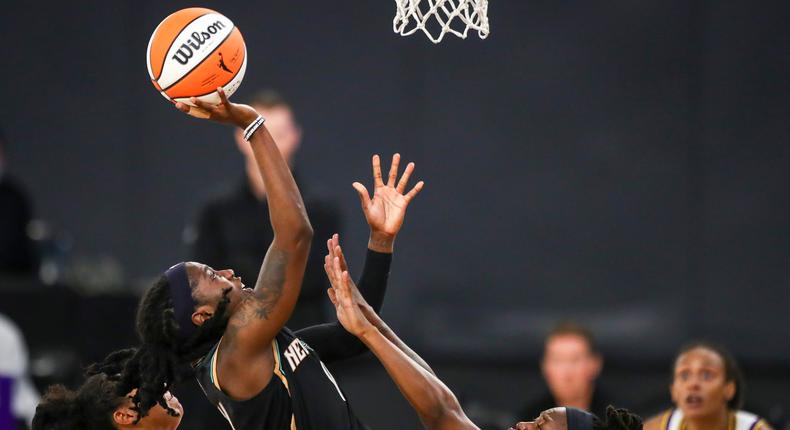 Guard Jazmine Jones of the New York Liberty shoots defended by guard Erica Wheeler of the Los Angeles Sparks on June 20, 2021.
