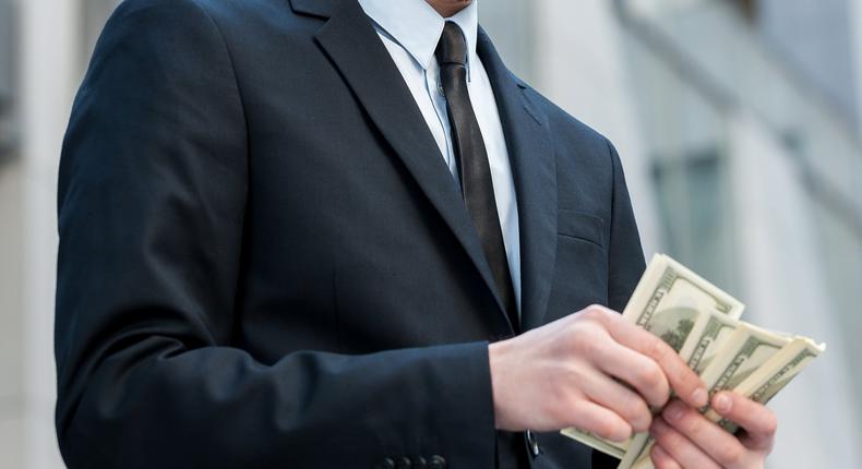 man counting money