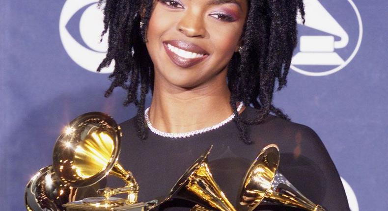 Lauryn Hill posing with her Grammy accolades