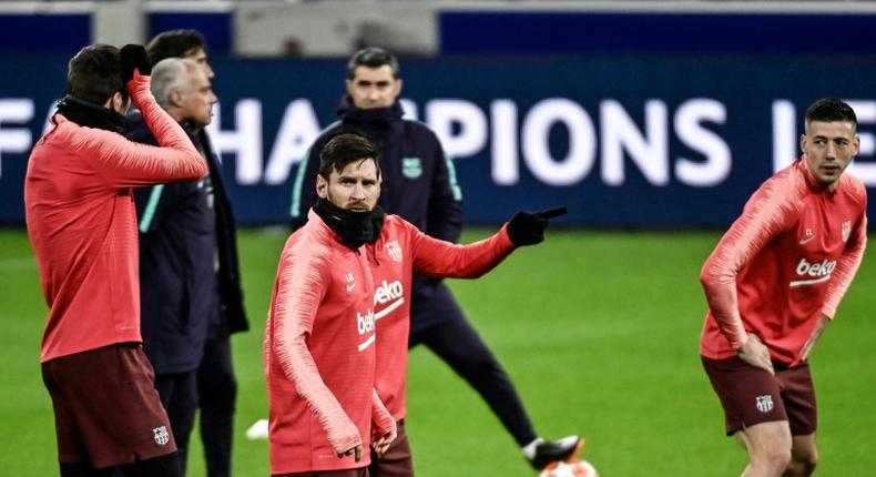 Lionel Messi (C) and his Barcelona teammates trained at Lyon's Groupama Stadium on Monday ahead of Tuesday's last 16, first leg