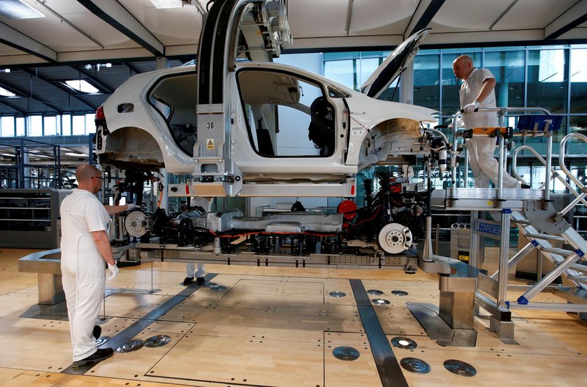 FILE PHOTO: Workers assemble a VW e-Golf electric car in Dresden