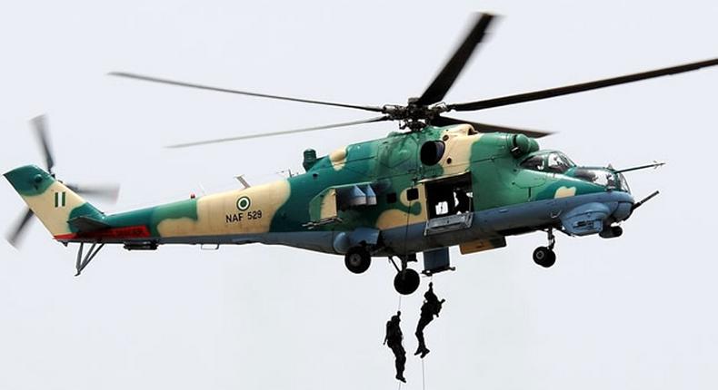 The Nigerian Air Force officers descend from one of the Nigerian fighter jets. [Punch]